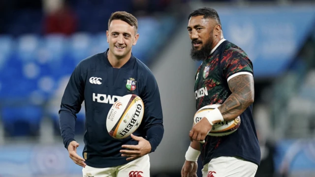 Alex Mitchell and Bundee Aki look on