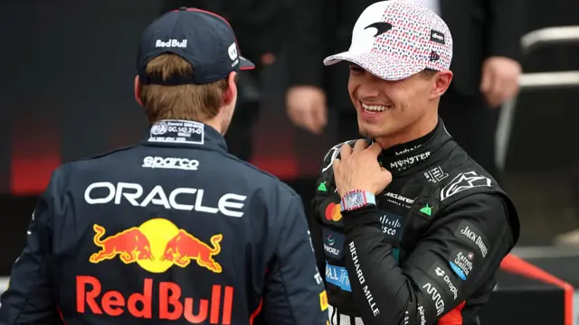 Lando Norris speaking to Max Verstappen