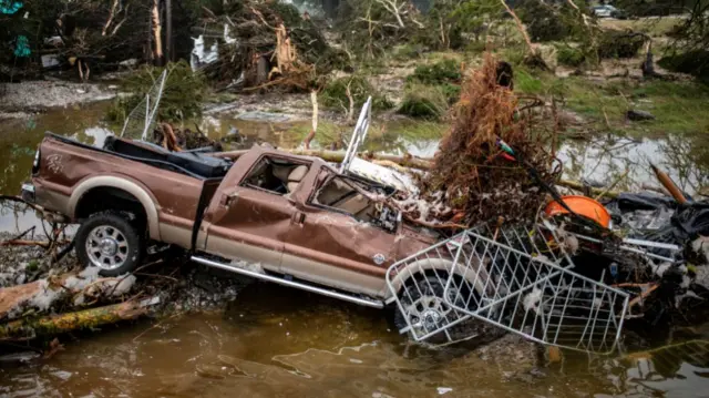 A pickup truck sits damaged after deadly flooding in Kerrville, Texas, U.S., July 5, 2025.