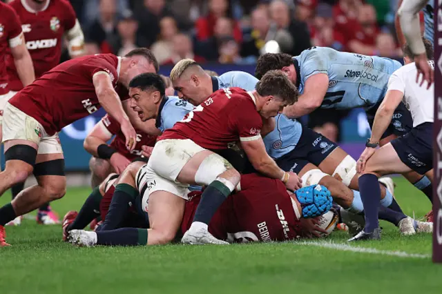 Waratahs players attempt to score a try