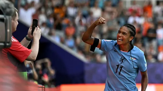 Netherlands' forward #11 Esmee Brugts celebrates after she scored the third goal of the match during the UEFA Women's Euro 2025 Group D football match between Wales and The Netherlands at the Allmend Stadion Luzern in Lucerne