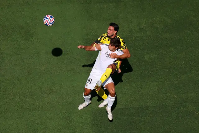 Gonzalo Garcia of Real Madrid is challenged by Ramy Bensebaini