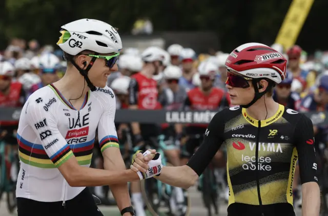 Tadej Pogacar and Jonas Vingegaard shake hands before the start of stage one of the 2025 Tour de France