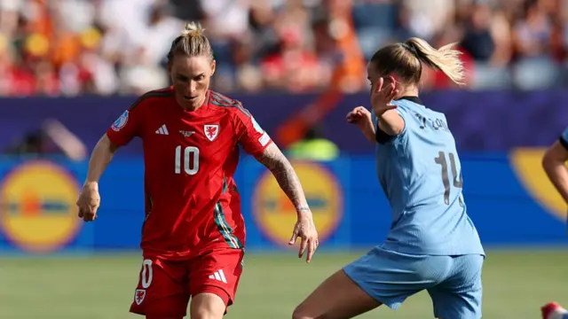 Fishlock dribbling the ball