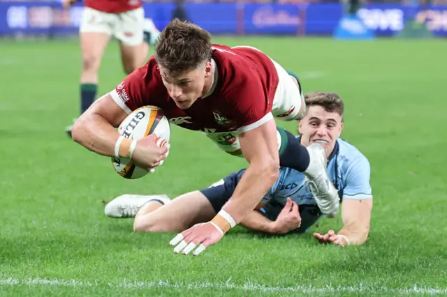 Huw Jones dives to score