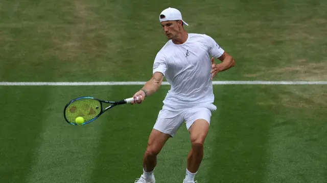 Marton Fucsovics plays a forehand