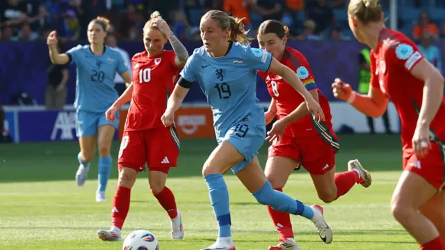 Netherlands' Wieke Kaptein in action with Wales' Angharad James