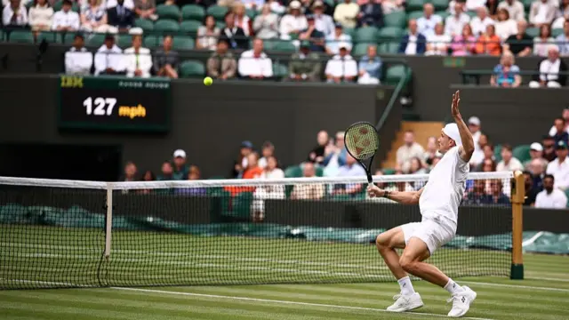 Marton Fucsovics plays a backhand return