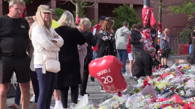 Anfield mourners gather with tributes including scarves and flowers
