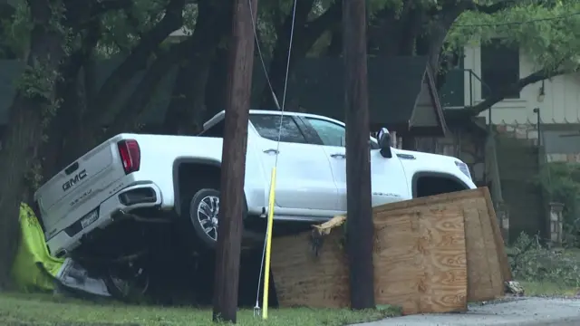 a truck is beached on a building in texas