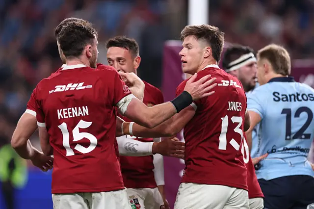 Huw Jones celebrates with teammates
