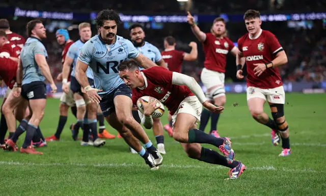 Alex Mitchell of the British & Irish Lions breaks clear and score