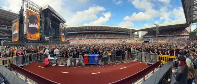 The stage is on the left with stands at Villa Park in the middle and right.