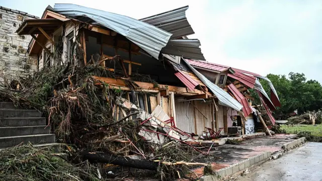 A damaged home is seen near Camp Mystic