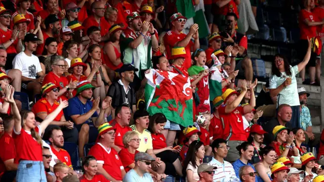 Fans of Wales show their support in the stands, as they enjoy the pre-match atmosphere prior to the UEFA Women's EURO 2025 Group D match between Wales and Netherlands at Luzern Arena