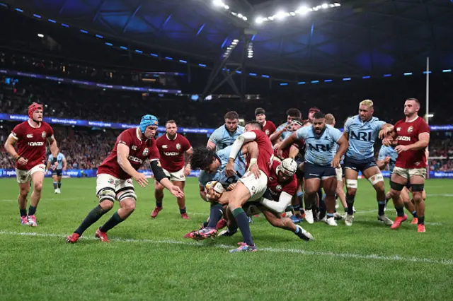 Charlie Gamble of the Waratahs scores a try