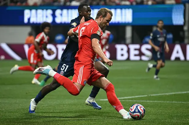 Harry Kane looks to cross the ball for Bayern Munich