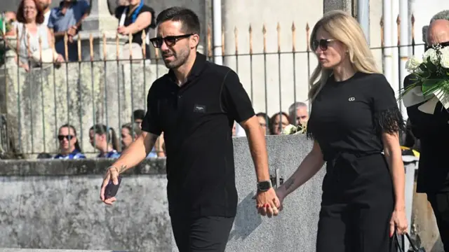 Joao Moutinho holds hands with his partner
