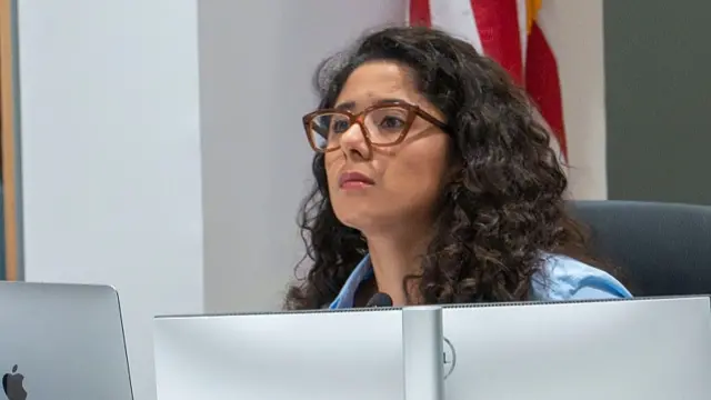 Harris County Judge Lina Hidalgo listens as a citizen voices concerns during Commissioners Court in Houston