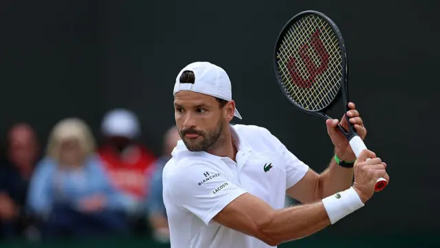 Grigor Dimitrov of Bulgaria plays a backhand