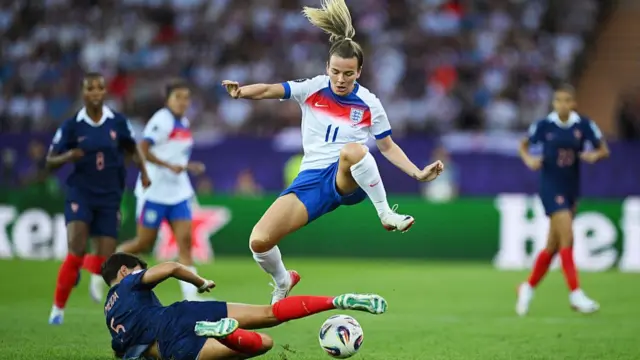 Lauren Hemp of England is challenged by Elisa De Almeida of France during the UEFA Women's EURO 2025 Group D match between France and England