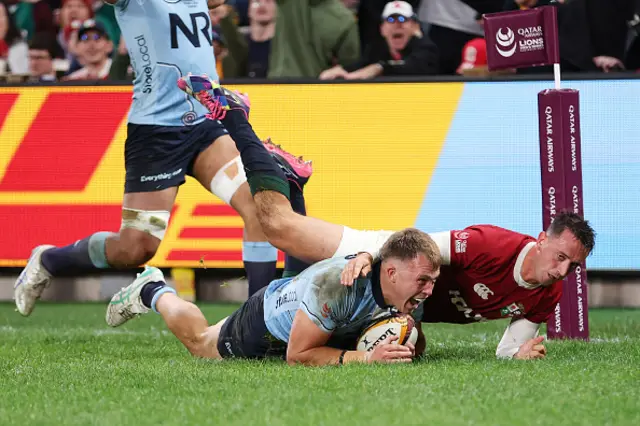 Darby Lancaster of the Waratahs scores a try