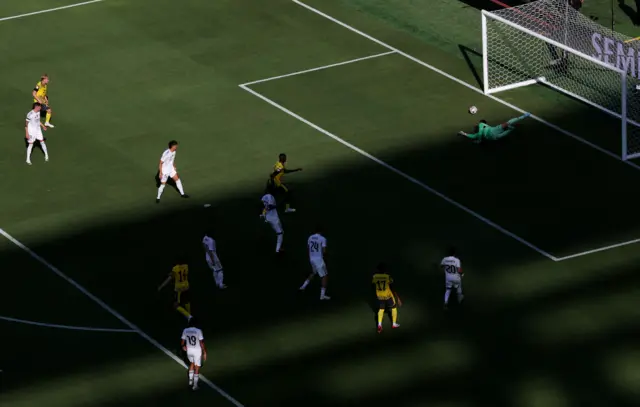 Borussia Dortmund's Maximilian Beier scores their first goal past Real Madrid's Thibaut Courtois