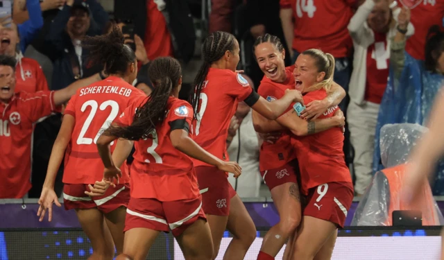 Switzerland's Geraldine Reuteler celebrates scoring their first goal with teammates