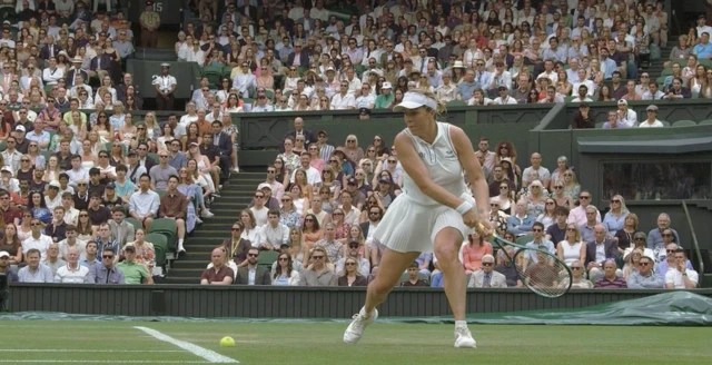 The ball lands out as Pavlyuchenkova prepares to play a backhand