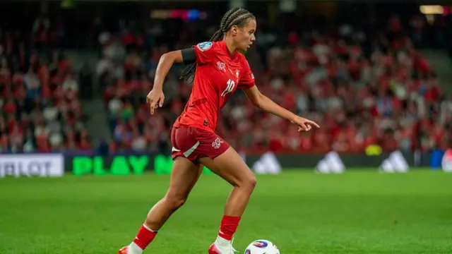 Iman Beney of Switzerland runs with the ball