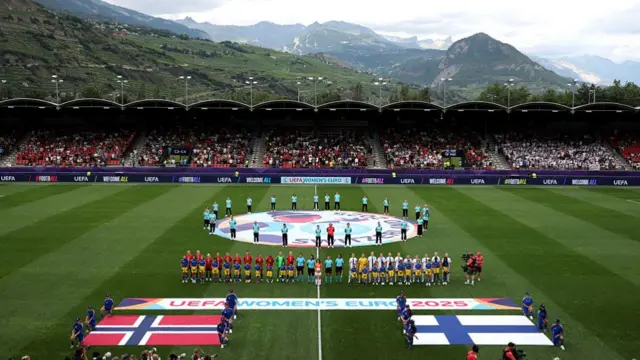 A general view inside the stadium as the match officials and players of Norway and Finland line up for the national anthems prior to the UEFA Women's EURO 2025 Group A match between Norway and Finland at Stade de Tourbillon