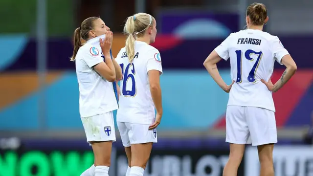 Katariina Kosola, Nea Lehtola and Sanni Franssi of Finland look dejected at full-time following the team's defeat in the UEFA Women's EURO 2025 Group A match between Norway and Finland at Stade de Tourbillon