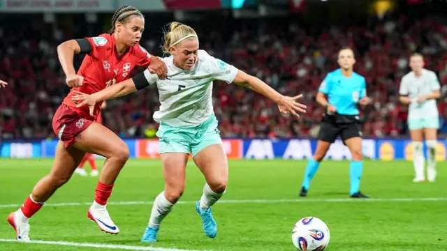 Iman Beney of Switzerland (L) and Saedis Run Heidarsdottir (R) battle for the ball during the UEFA Womens EURO 2025 Group A match between Switzerland and Iceland