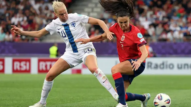 Eveliina Summanen of Finland battles for possession with Ingrid Syrstad Engen of Norway during the UEFA Women's EURO 2025 Group A match between Norway and Finland at Stade de Tourbillon