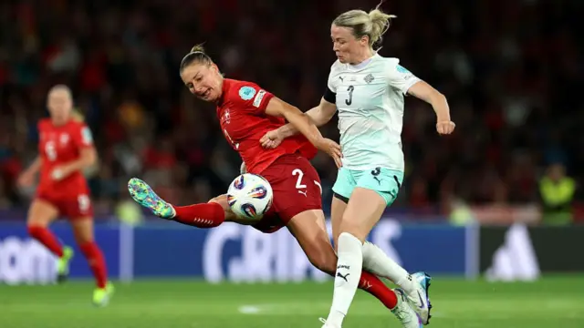 Julia Stierli of Switzerland battles for possession with Sandra Maria Jessen of Iceland during the UEFA Women's EURO 2025 Group A match between Switzerland and Iceland at Stadion Wankdorf