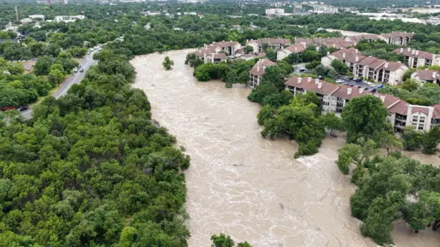 A drone view shows the swollen San Gabriel river
