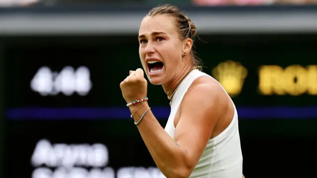 Aryna Sabalenka celebrates winning the first set