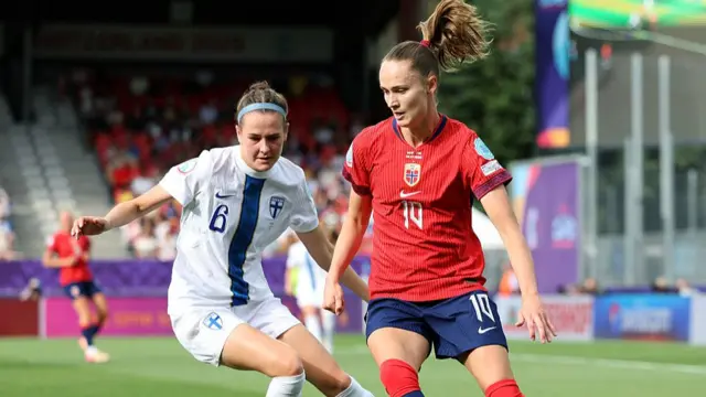Caroline Graham Hansen of Norway controls the ball whilst under pressure from Joanna Tynnila of Finland during the UEFA Women's EURO 2025 Group A match between Norway and Finland at Stade de Tourbillon