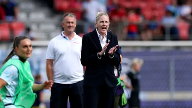 Gemma Grainger, Head Coach of Norway, applauds as her players warm up prior to the UEFA Women's EURO 2025 Group A match between Norway and Finland at Stade de Tourbillon