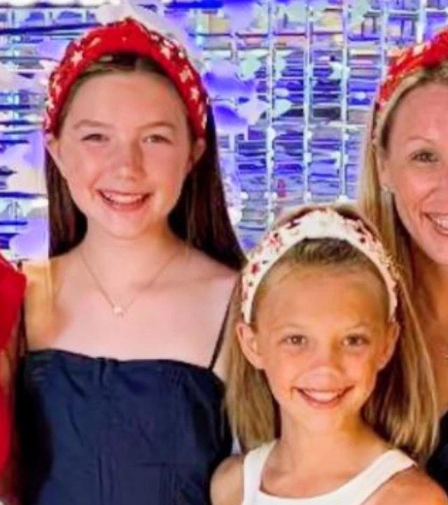 Family portrait of Blair Harber, 13, and Brooke Harber, 11. Both girls are smiling at the camera and wearing head bands