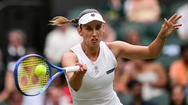 Elise Mertens plays a forehand return