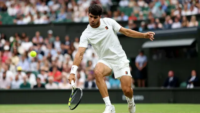 Carlos Alcaraz of Spain plays a backhand volley