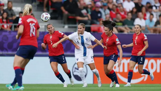 Ria Oeling of Finland is challenged by Marit Bratberg Lund and Ingrid Syrstad Engen of Norway during the UEFA Women's EURO 2025 Group A match between Norway and Finland at Stade de Tourbillon