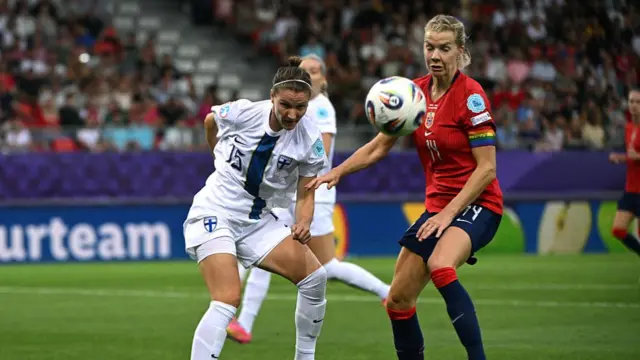 Finland's defender #15 Natalia Kuikka fights for the ball with Norway's forward #14 Ada Hegerberg during the UEFA Women's Euro 2025 Group A football match between Norway and Finland at the Stade de Tourbillon in Sion