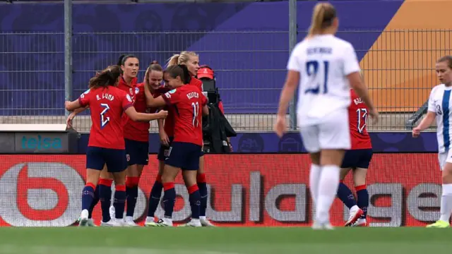 Players of Norway celebrate after Eva Nystroem of Finland (not pictured) scores a own goal and Norway's first during the UEFA Women's EURO 2025 Group A match between Norway and Finland at Stade de Tourbillon