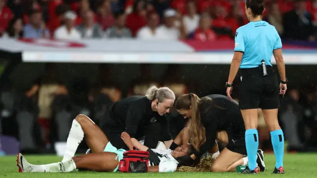 Iceland's Sveindis Jonsdottir receives medical attention after sustaining a neck injury