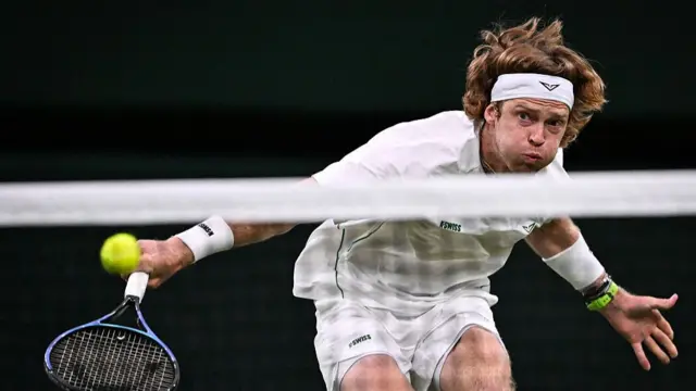Andrey Rublev plays a backhand return