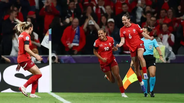 Switzerland's Geraldine Reuteler celebrates scoring their first goal with Iman Beney