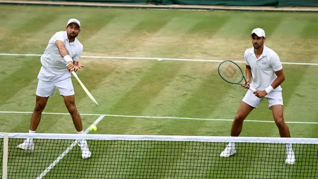 Marcelo Arevalo and Mate Pavic in action