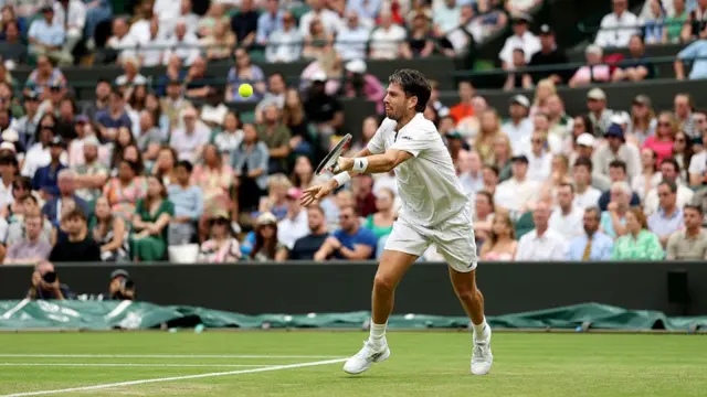 Cameron Norrie of Great Britain plays a backhand